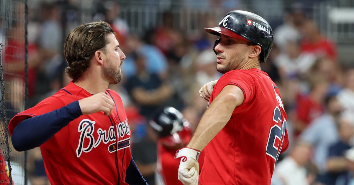 Photo: rds.ca ATLANTA, GA - OCTOBER 01: Matt Olson #28 of the Atlanta Braves celebrates with Austin Riley #27 after hitting a solo home